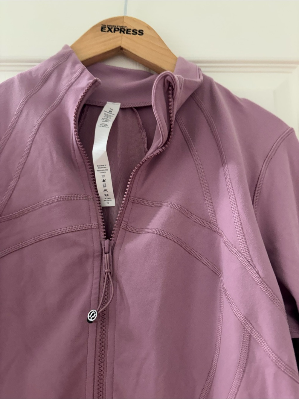 LuluLemon pink taupe define jacket 
Size 10